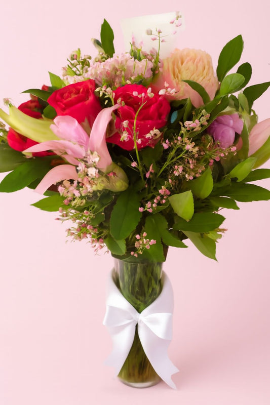 Serene Elegance – Floral Arrangement in Glass Vase